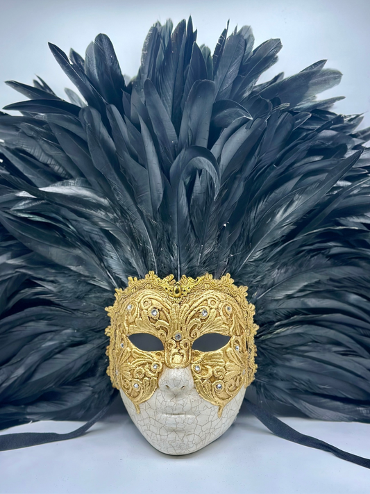 Full-face golden Venetian mask with black feathers
