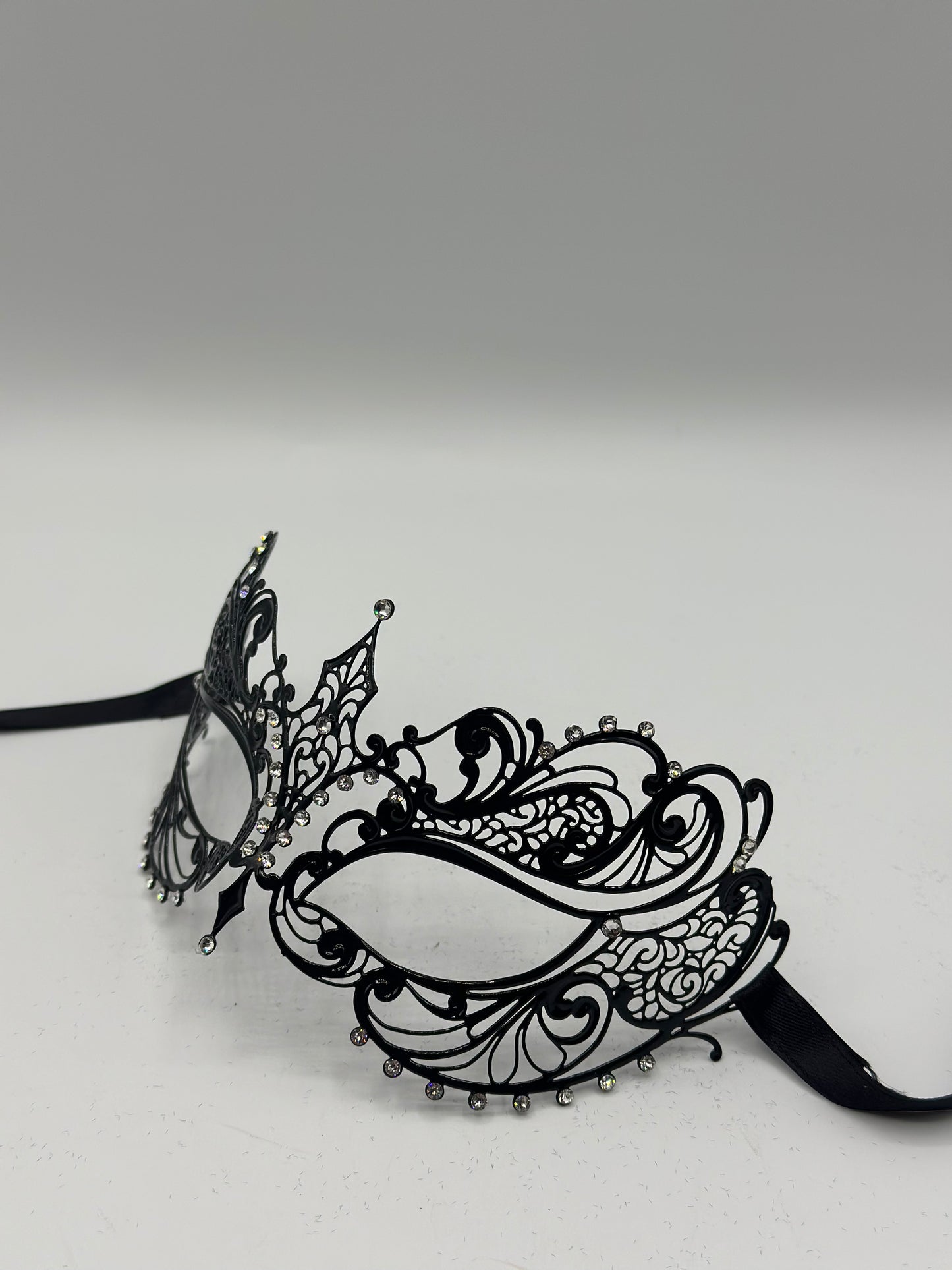 Masquerade mask for women "Melody" - Venetian mask of black metal with strass stones