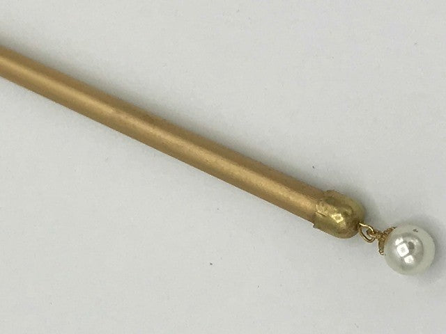 Mask stick in gold